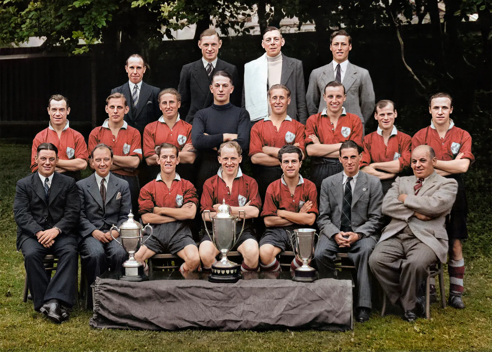 The same team photograph after hand colourisation